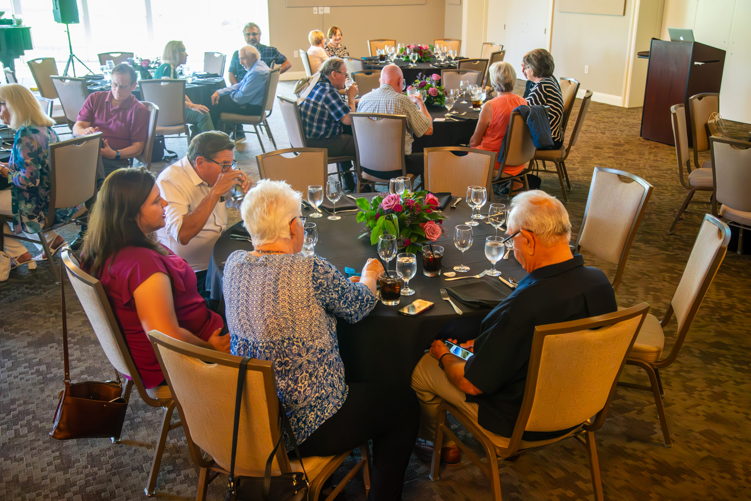 People seated at a banquet table
